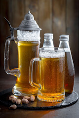 Light beer in a glass on an old background.