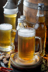 Light beer in a glass on an old background.