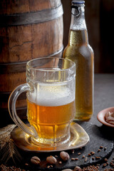 Light beer in a glass on an old background.