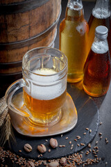 Light beer in a glass, on an old background.