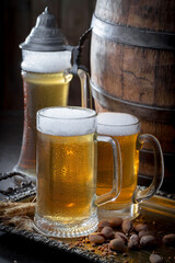 Light beer in a glass on an old background.