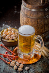 Light beer in a glass, on an old background.