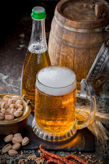 Light beer in a glass on an old background.