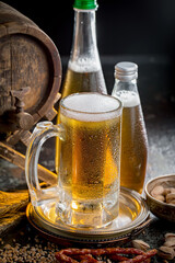 Light beer in a glass on an old background.