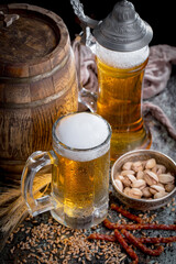 Light beer in a glass, on an old background.