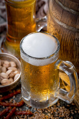 Light beer in a glass on an old background.