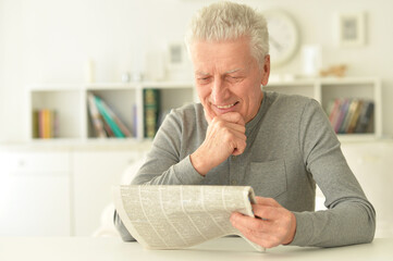 senior man  reading newspaper