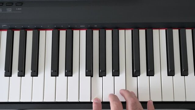 hands playing basic piano
