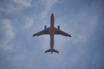 flying airplane photographed from below