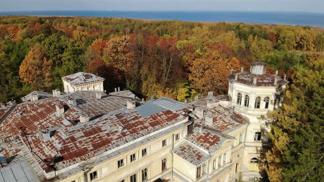 Abandoned manor Mikhailovka estate, palace and park of the 19th century. Peterhof, public access, Saint-Petersburg. Autumn. Aerial drone view. Flying over. View from top down. Drone is moving forward