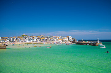 View of St. Ives town, Cornwall, England, from across the clear, blue water, on a sunny, summer's day. Room for copy. © parkerspics