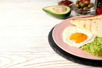 Concept of tasty breakfast on white wooden background