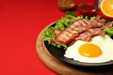 Concept of tasty breakfast on red background