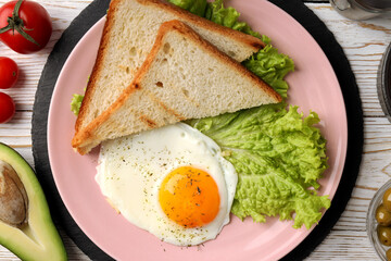 Concept of tasty breakfast on white wooden background