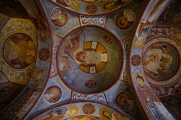 Fototapeta na wymiar Frescos and murals in ancient cave Apple Church or Elmali Kilise painted in directly onto rock, Goreme, Cappadocia, Turkey