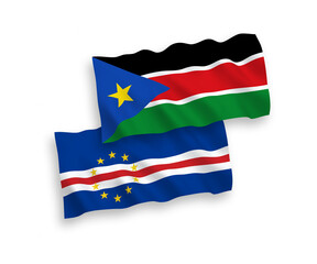 National vector fabric wave flags of Republic of Cabo Verde and Republic of South Sudan isolated on white background. 1 to 2 proportion.