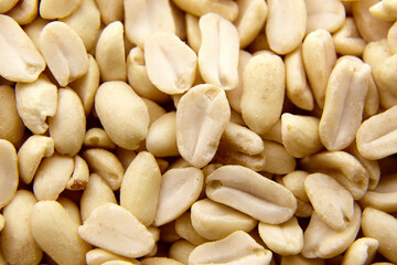 Raw blanched peanuts as food background