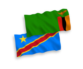 National vector fabric wave flags of Republic of Zambia and Democratic Republic of the Congo isolated on white background. 1 to 2 proportion.