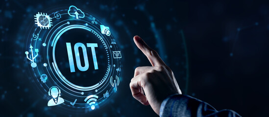 Internet of things - IOT concept. Businessman offer IOT products and solutions. Internet, business, Technology and network concept. Virtual button.
