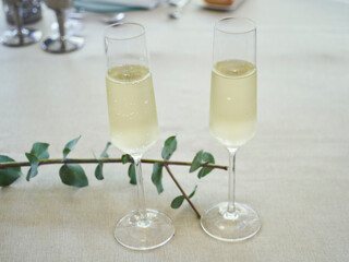 Two glasses of champagne on a wedding table