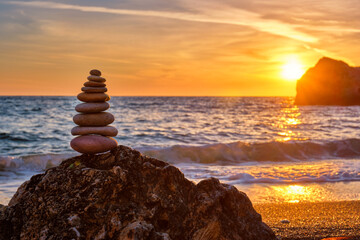 Concept of balance and harmony - stone stack on the beach