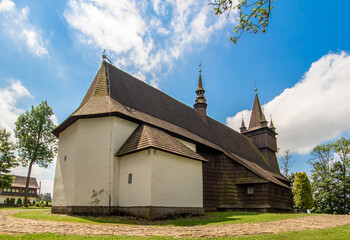 Fototapeta premium Orawka, Poland - finished in 1650, the John the Baptist Church is one of the finest wooden churches in Southern Poland. Here in particular the external shape