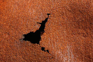 A close-up of rusting metal on a junkyard
