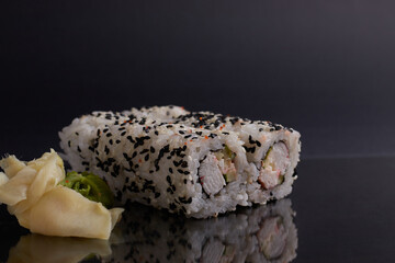 a portion of rolls on a stand, japanese food, sushi on the table, chinese chopsticks, light background