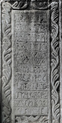 Ancient stone with medieval latin writing. Ancient church