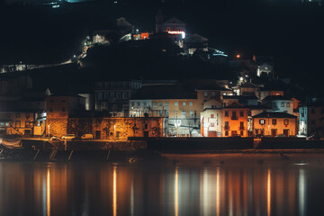 Fototapeta na wymiar A village near water photographed at night in Portugal