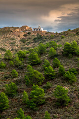 Fototapeta na wymiar The Albir lighthouse in the Sierra Helada in Alicante, Spain