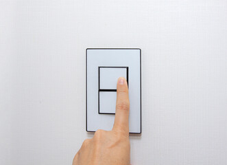 The finger of the person who controls the switch.