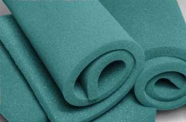 two rolls of blue foam material. soft sponge texture