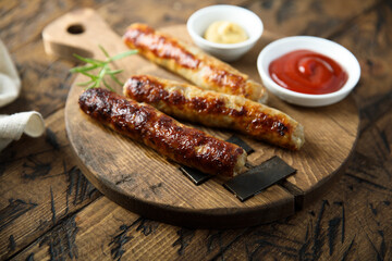 Homemade roasted sausages with ketchup and mustard	