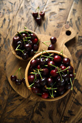 Fresh ripe cherry in a wooden bowl