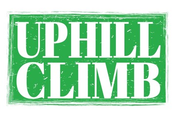 UPHILL CLIMB, words on green grungy stamp sign