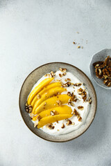 Yogurt with granola and mango