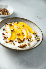 Yogurt with granola and mango