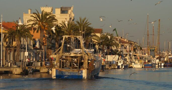 Le Grau du Roi, Gard, France. Fishing boats coming back to the harbour.