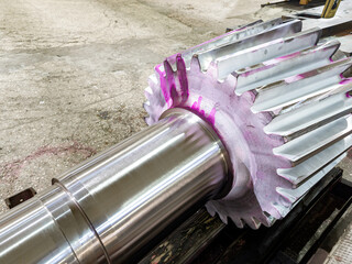 Long helical gears are made on the machine in the workshop in the warehouse.