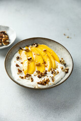 Yogurt with granola and mango