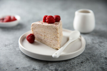 Homemade crepes cake with raspberry cream