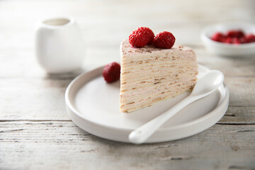 Homemade crepes cake with raspberry cream