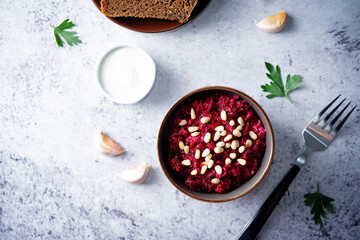 Beetroot salad with pine nuts in a bowl