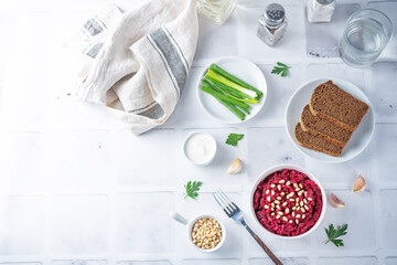 Beetroot salad with pine nuts in a bowl