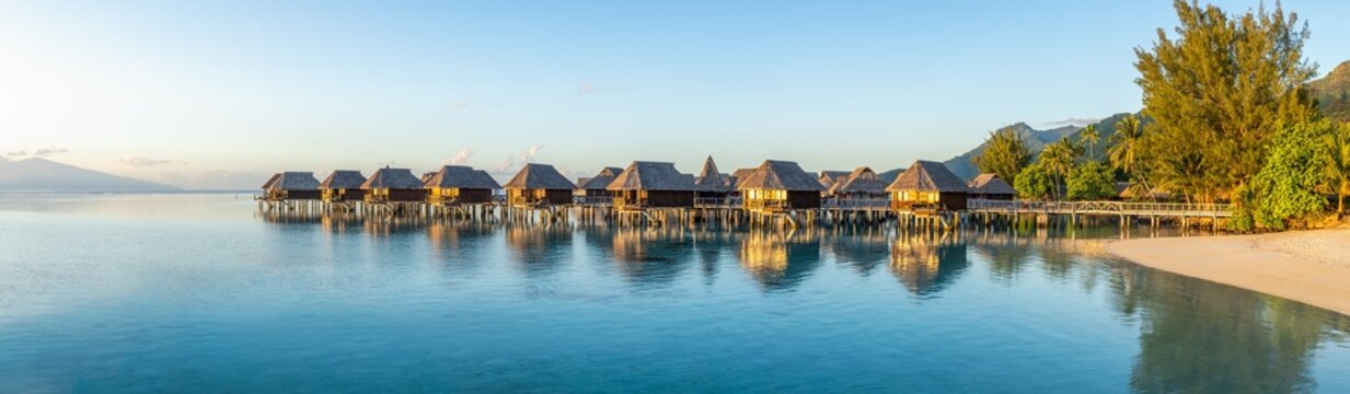 Overwater bungalows at a luxury beach resort on Moorea island, French Polynesia