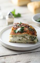 Traditional homemade frittata with herbs and cheese