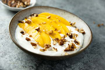 Yogurt with granola and mango