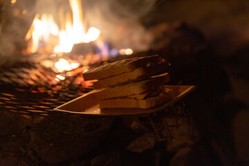 Making food on campfire.  Dark winter evening