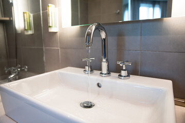 faucet of a sink in modern bathroom for interior design